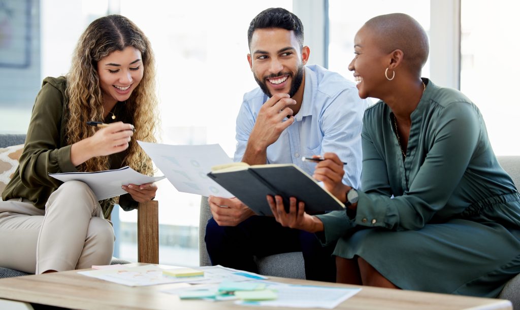 Marketing, teamwork and business people collaboration for target audience research, kpi paper data analysis and brand innovation. Smile, happy and comic advertising workers planning startup campaign